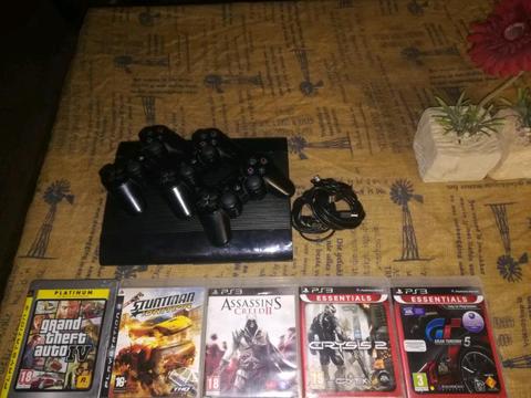 PS3 500 Gig Super Slim New 8 Months 3 Sony Remotes 5 Games