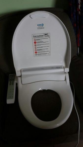 Full Electric control toilet seat in excellent condition,change of plans forces sale