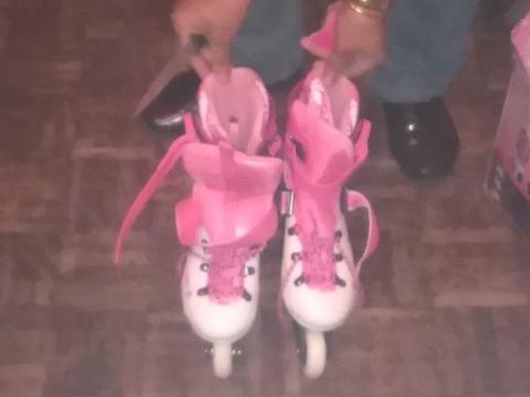 Brand new girls pink and white roller blades shoe size 4-6