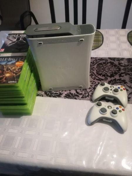 Xbox 360 with 2 controllers and 27 games