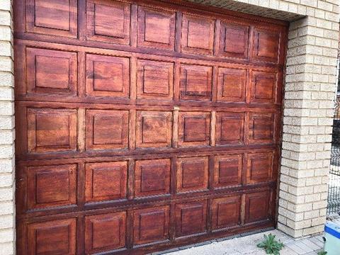 Two single wooden garage doors for sal