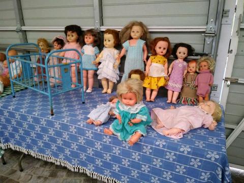 Old collectible dolls plus old metal cot