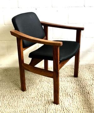 Mid century chair in black vinyl