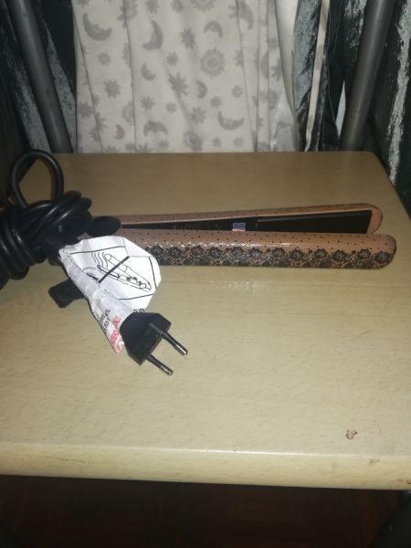 Aria Beauty flat iron for sale!