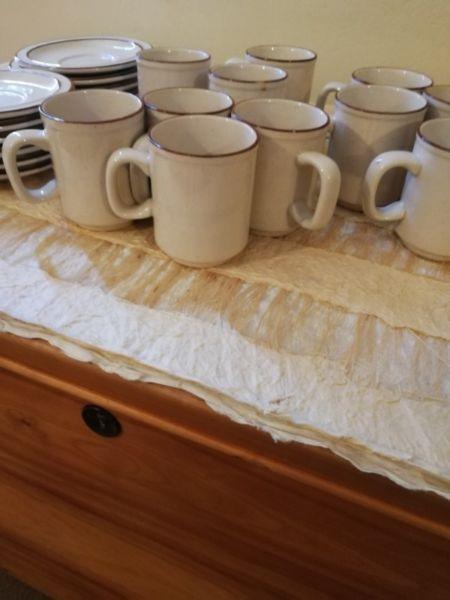 Stoneware mugs and saucers