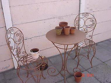 Wrought iron rustic chairs and table