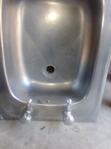 Stainless steel sink with cobra taps