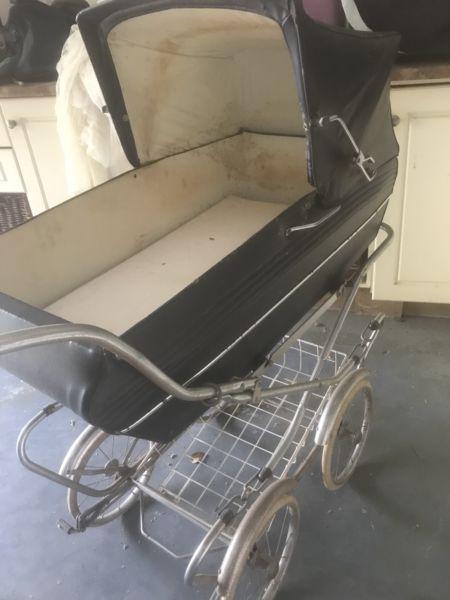 Old fashioned pram in need of restoration
