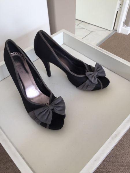 Black and grey heels