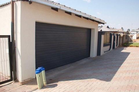 Single and double aluzinc sectional doors in Alberton