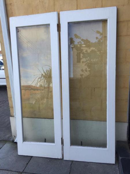 A set of 5 Oregon interlocking Glass & wood framed doors