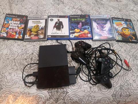 PlayStation 2 - 6 Games + 2 Remotes