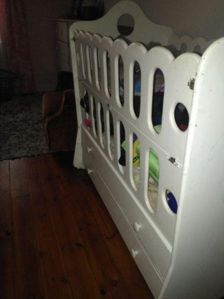 White wooden baby cot