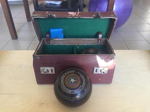 Vintage lawn bowls with carry case