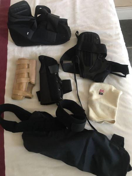 Med boots. Arm sling and wrist protectors