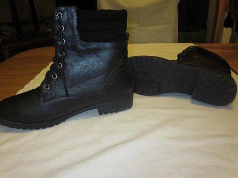 Ladies size 7 black lace up boots. Never worn