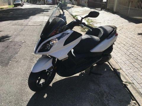 With the open road performance of a maxi scooter and sport bike