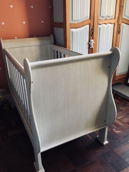 Ivory colored sleigh cot