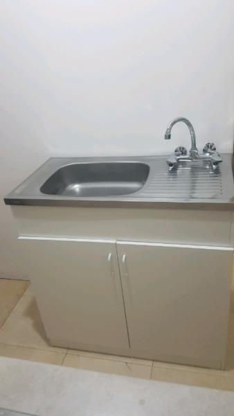 sink with cupboard and mixer