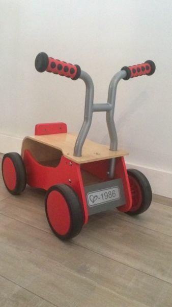 Hape little red wooden rider