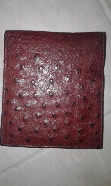 Genuine cognac coloured ostrich bi fold wallet with tooled interior and South African Railway logo