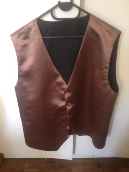 2 shirts and a vest for sale