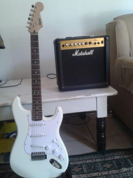 Squier Strat guitar by Fender + Marshall amp