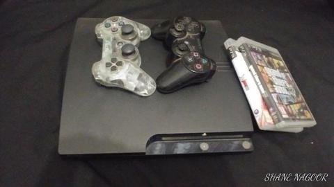 Ps3 console for sale with 2 controllers and 3 games