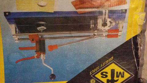 Tile cutter with hole cutter attachment