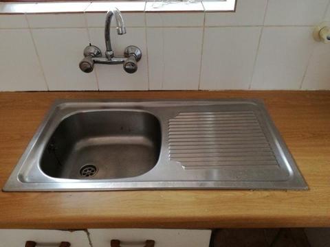 Kitchen sink with taps