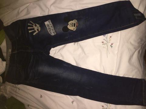 Dark blue jeans with patches