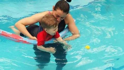 SWIMMING LESSONS IN AN INDOOR HEATED POOL