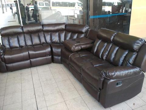 Brown Leather Half Moon Recliner Couch Still in a good condition at a very cheap Price