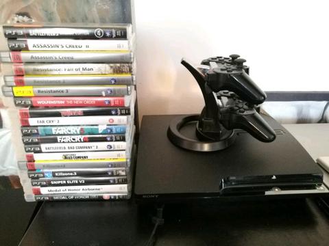PS3 CONSOLE + ASSORTED GAMES+ CHARGING STAND