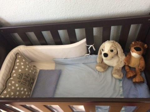 Brown sleigh cot for sale