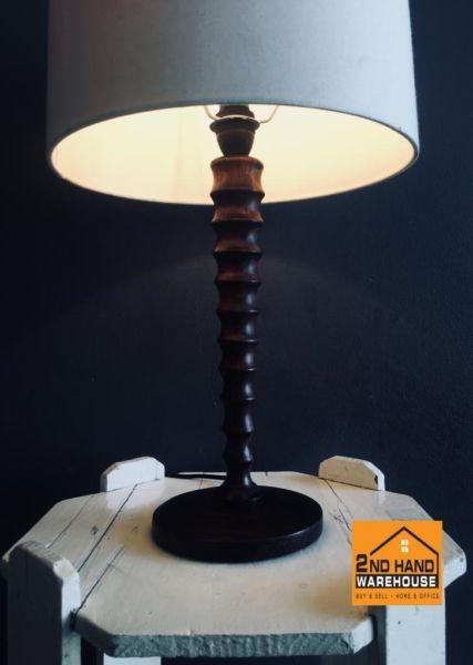 Bedside lamp with twisted wooden base and shade