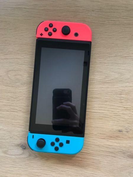 Nintendo Switch and two games