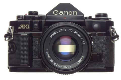 CANON A-1 black 35mm SLR film camera with FD 50 1:1.8 lens strap and cap