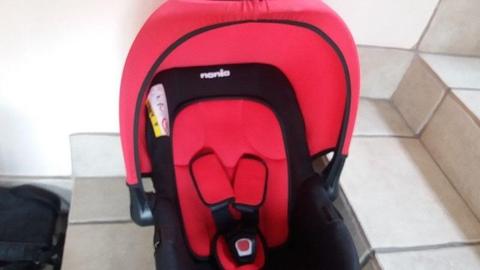 Nania red and black baby car seat/carrier