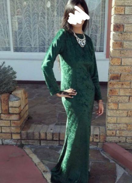 Emerald green velvet fitted dress with train