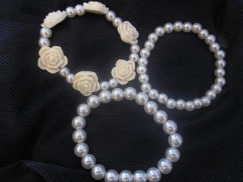 Pearly set of bracelets. One bracelet with Roses