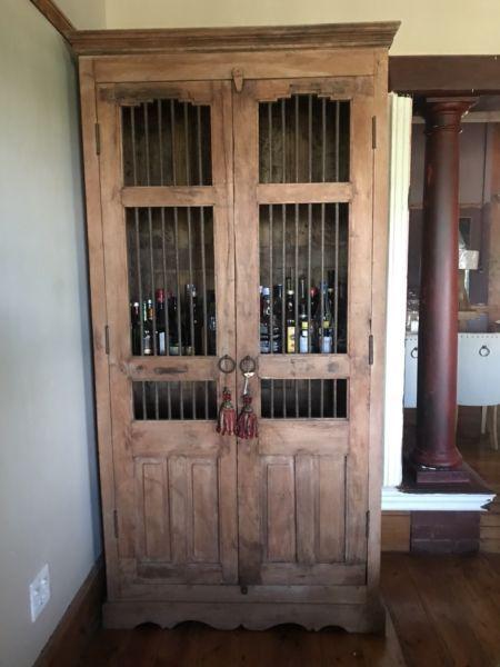 Iron bars on natural wood ideal for drinks cabinet, ask for upmarket item @heyjudes