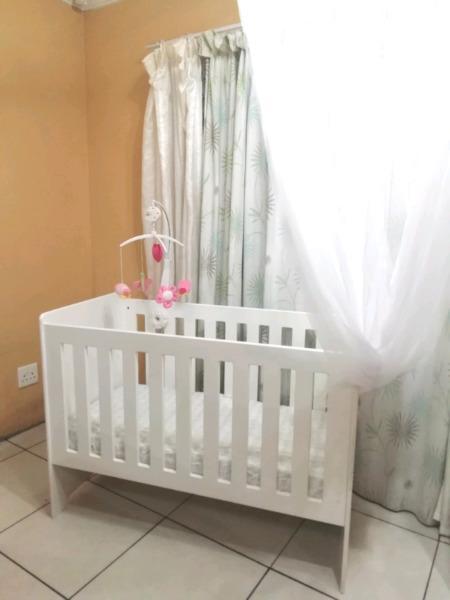 Wooden cot with accessories