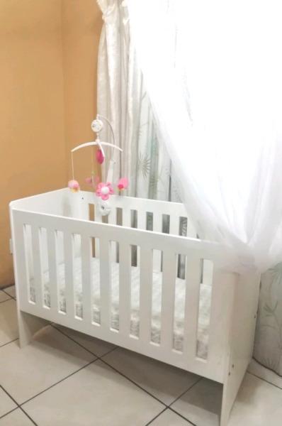 Wooden cot with accessories