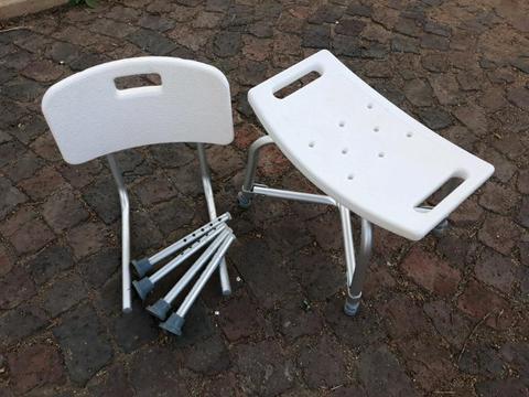 Shower Chair with detachable backrest and adjustable legs. In good condition