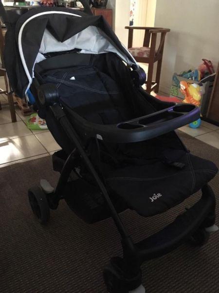 Joie pram with car seat and rain cover for sale.Raincover never been used. R1900
