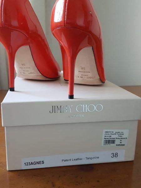 Designer shoes. Tangerine Jimmy Choo heels. Size 6. Used but in excellent condition. R4000