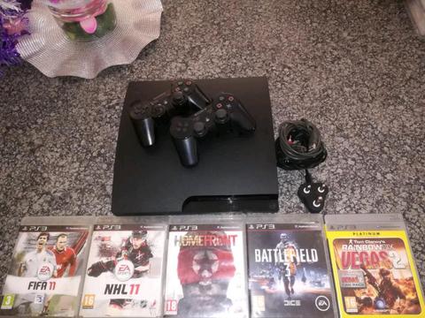 PS3 320 Gig Slimline New 8 Months 2 Sony Remotes 5 Games