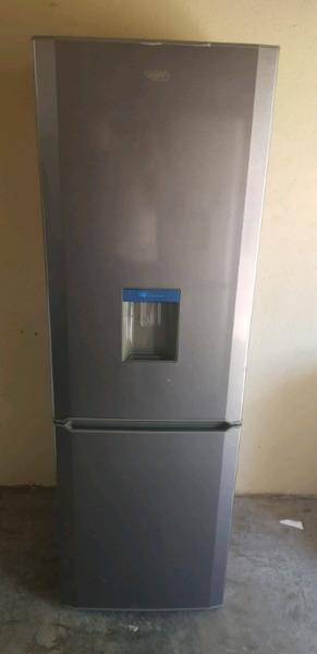 Defy big silver fridge with water dispenser