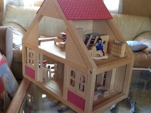 Wooden dollhouse imported from Germany